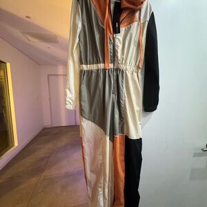 Fashion Nova Colorblock Hooded Jumpsuit in Orange, Black, Cream, Gray